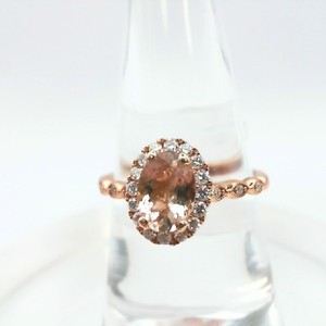  Oval Morganite in Diamond Halo setting